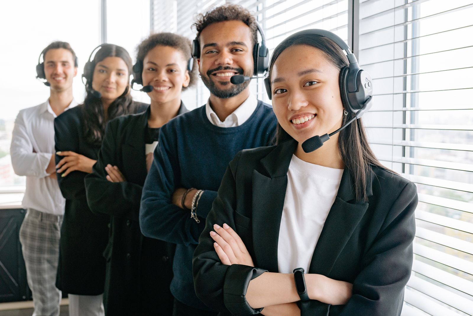 Polished customer-ready team with headsets prepared for inbound AI-assisted business calls
