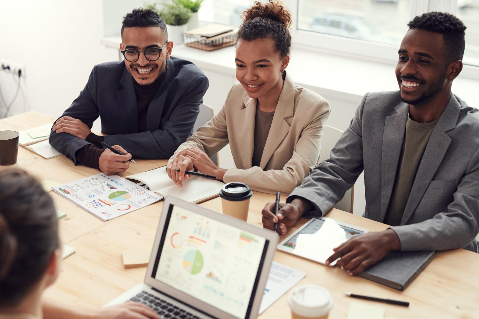 Polished marketing strategy team reviewing brand narrative and search data in a modern conference room