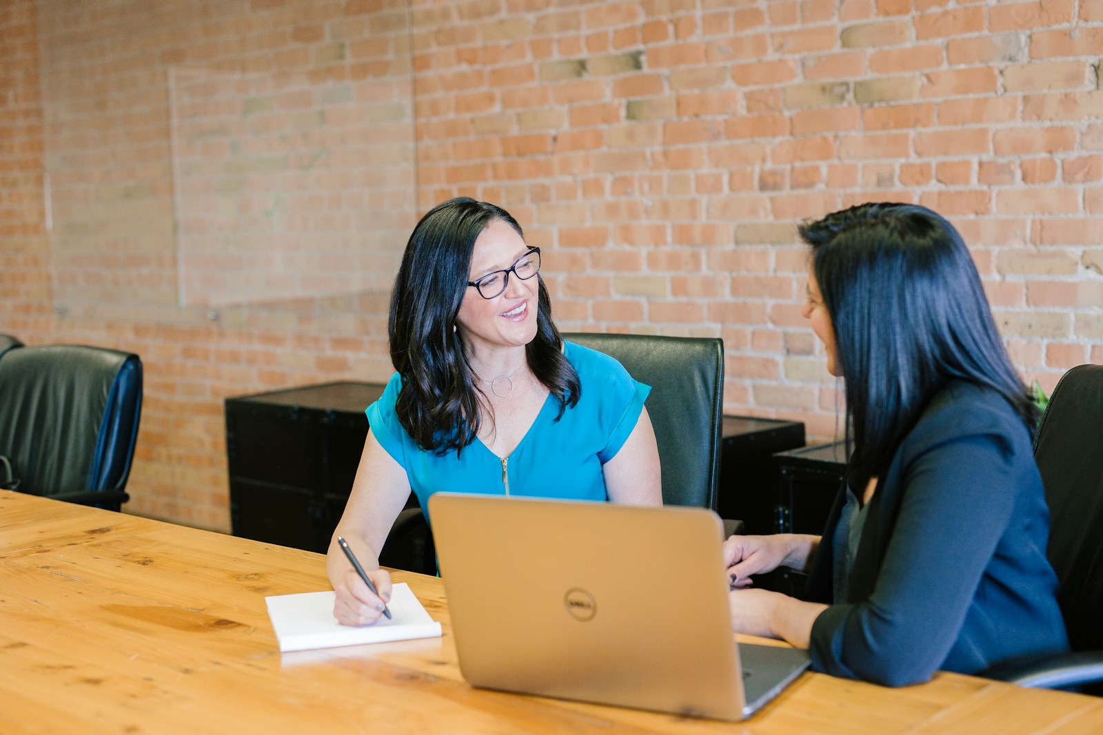 Strategy consultation between marketing advisors in a modern office