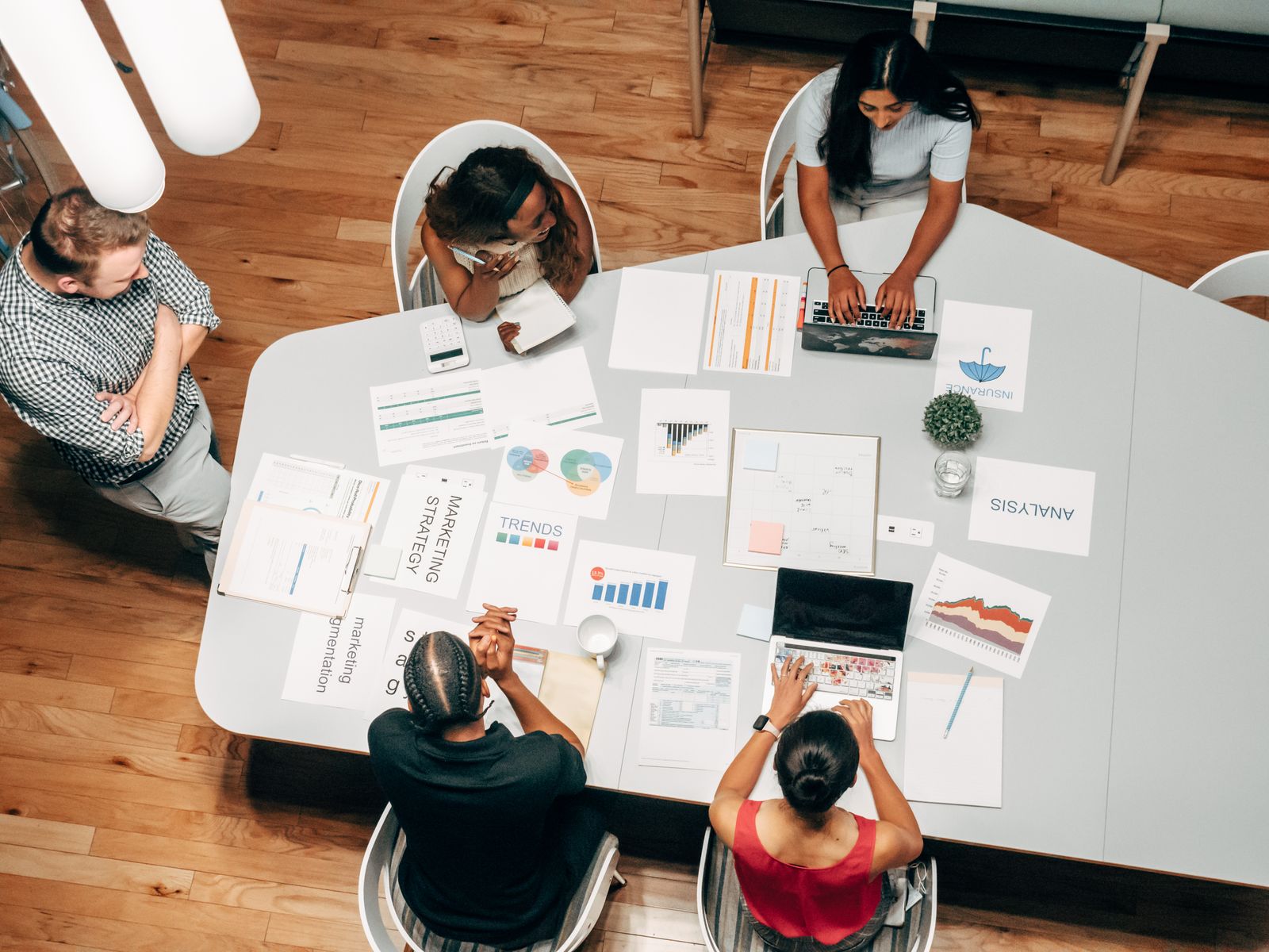  style strategy briefing with marketing reports on the table